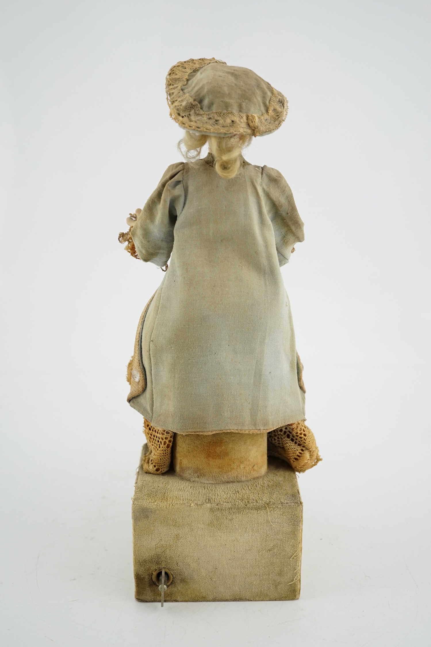 A German automaton of a flower seller, 39cm high